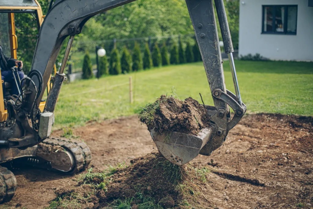 Working Excavator Digging A Trench At Monmouth, IL.